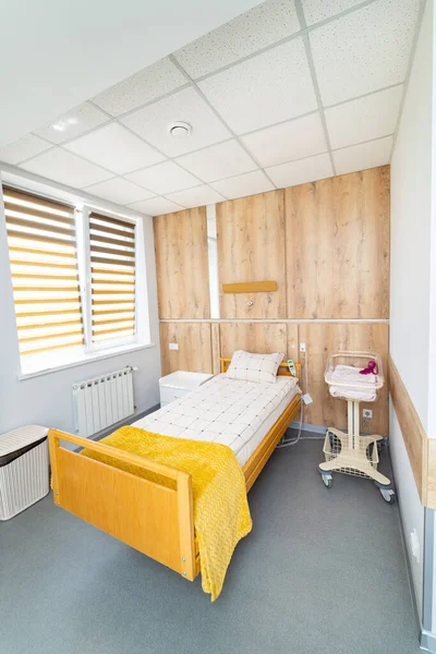 Interior of modern comfortable hospital ward. Recovery room with new beds.