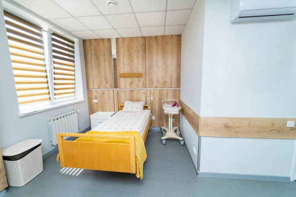 Recovery room with new bed. Interior of modern comfortable hospital ward.