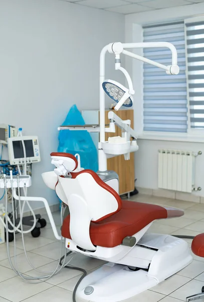 Dental professional indoors healthcare. Modern sterile dentistry room.