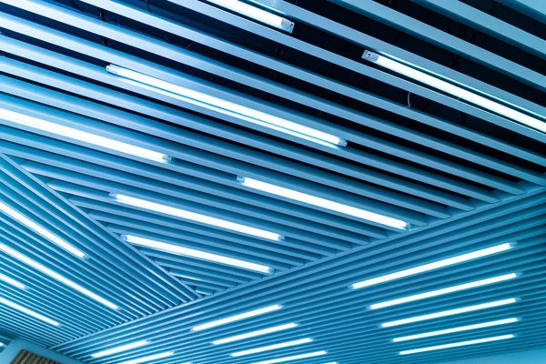 Abstract blue line pattern ceiling. Geometric hitech office interior.