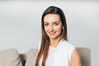 Portrait of pretty lady in white cloth. Beautiful lifestyle smiling woman.