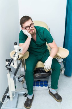 Professional gynecologist with device. Young doctor device diagnostic.