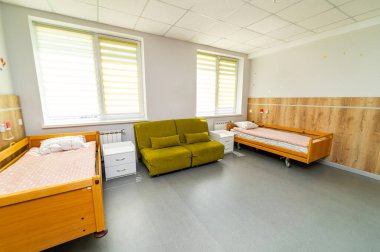 Interior of recovery comfortable ward. Empty modern hospital room.