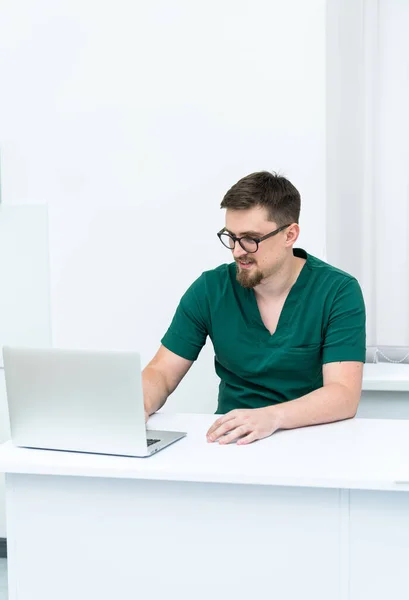 Professional medical specialist working with computer. Healthcare modern hospital doctor with laptop.