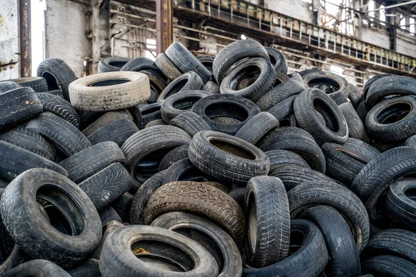Disposal of waste tires. Landfill with old tires and tyres for recycling.