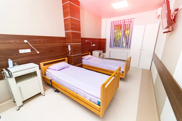 Empty modern recovery room. Medical ward with comfortable bed.