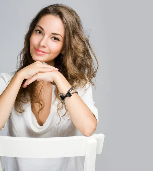 Friendly pensive brunette beauty. Stock Image