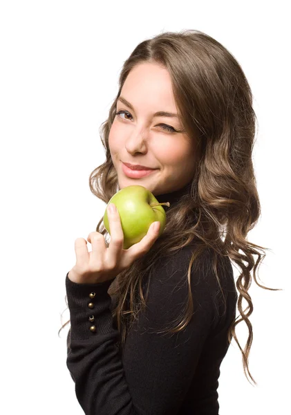 Fit young brunette with green apple. — Stock Photo, Image