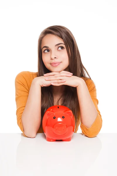 Morena com banco porquinho . — Fotografia de Stock