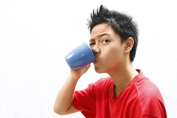 Teenager Drinking from Mug — Stock Photo, Image