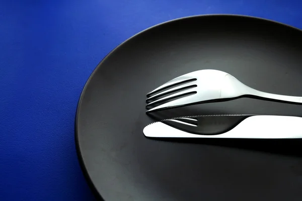 Fourchette, couteau et assiette — Photo