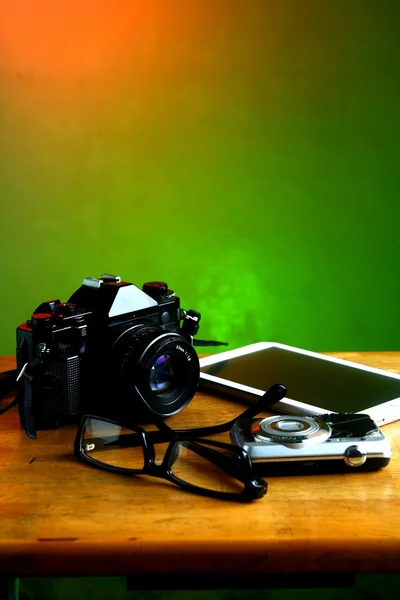 Camera, tablet and eyeglasses — Stock Photo, Image