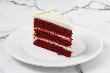 Photo of a slice of freshly made red velvet cake.