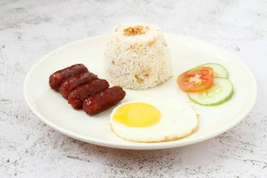 Photo of freshly cooked Filipino food called Longsilog or cured pork sausage, egg and fried rice.
