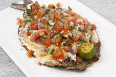 Photo of freshly cooked Fried Boneless Bangus or fried boneless milkfish.