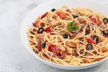 Photo of freshly cooked spaghetti pasta in carbonara sauce with tuyo or dried fish..