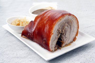 Photo of freshly cooked Filipino food called Lechon Pork Belly or roasted pork belly. clipart