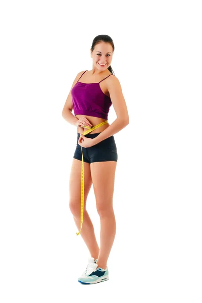Mujer joven con una cinta métrica alrededor de su cintura — Foto de Stock
