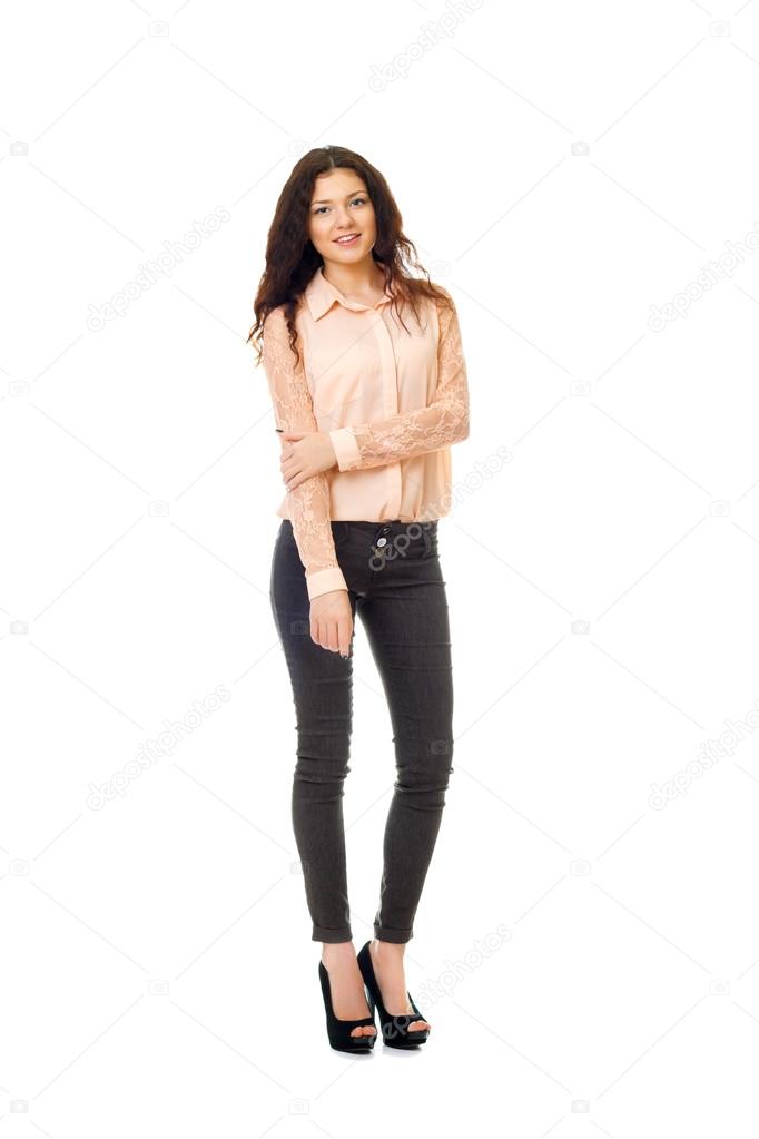 brown-haired woman in dark jeans and light shirt