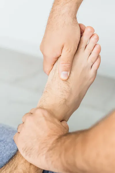 Osteopath Working Ankle Close Stock Picture