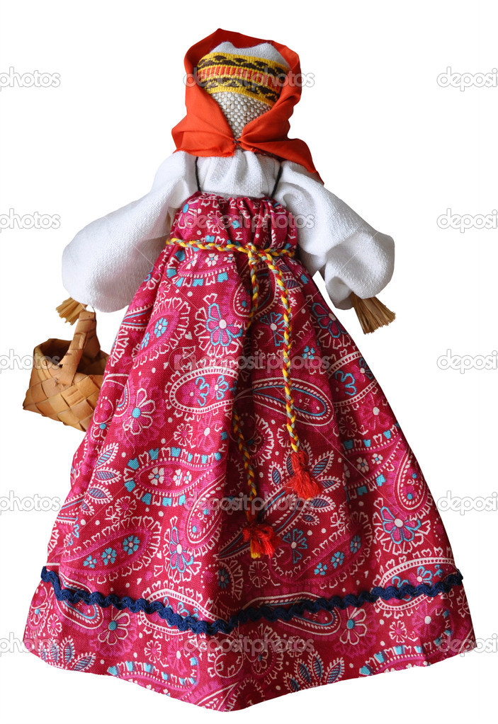 Hand made doll in traditional dress, Russia, isolated against wh