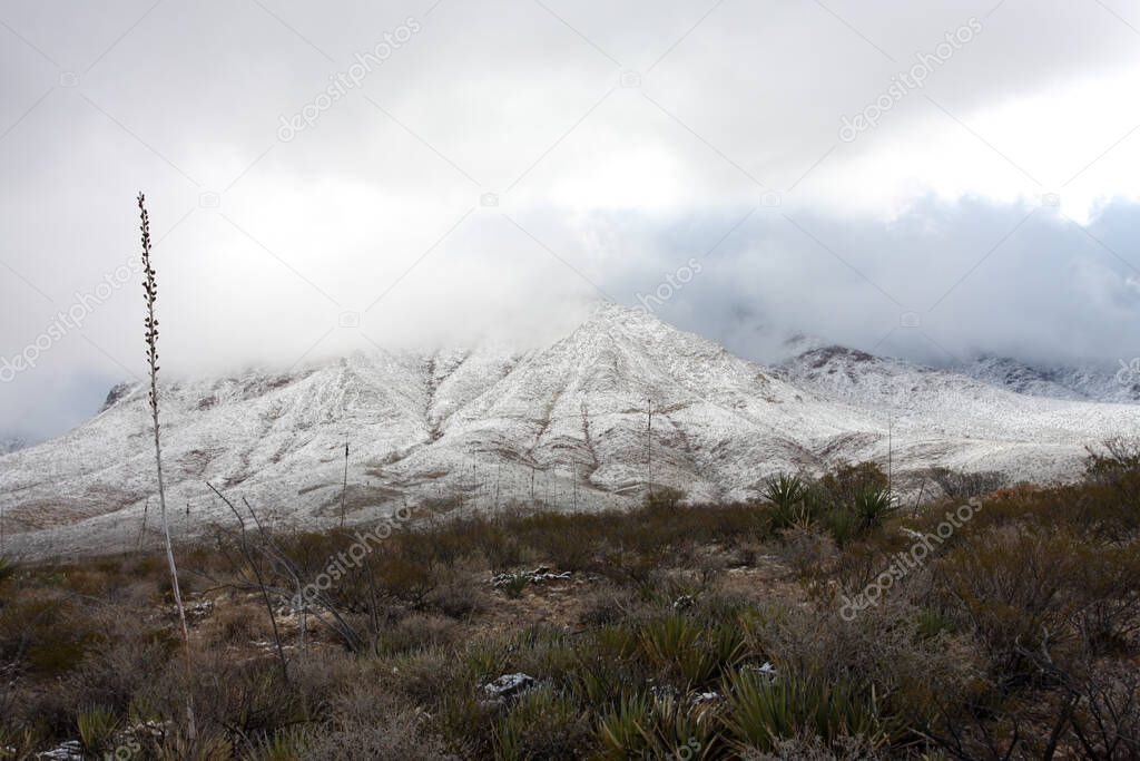 Franklin Mountains on the Westside of El Paso, Texas, covered in snow looking towards Trans Mountain Road