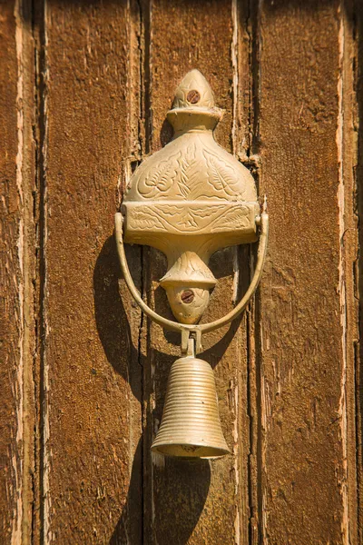 Closeup of antique bell on door — Stock Photo, Image