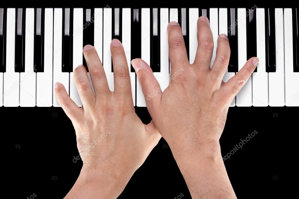 Hands on a Piano Keyboard