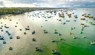 Mui Ne fishing village seen from above with hundreds of boats anchored to avoid storms, this is a beautiful bay in central Vietnam