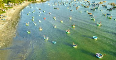Mui Ne fishing village seen from above with hundreds of boats anchored to avoid storms, this is a beautiful bay in central Vietnam