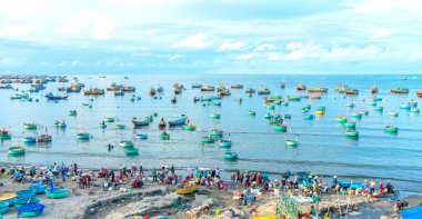 Mui Ne fish market seen from above, the morning market in a coastal fishing village to buy and sell seafood for the central provinces of Vietnam