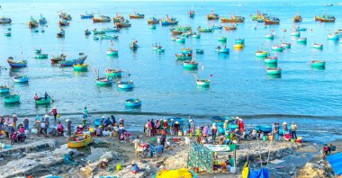 Mui Ne fish market seen from above, the morning market in a coastal fishing village to buy and sell seafood for the central provinces of Vietnam