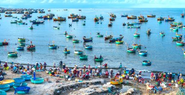 Mui Ne fish market seen from above, the morning market in a coastal fishing village to buy and sell seafood for the central provinces of Vietnam