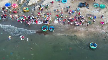 Mui Ne fish market seen from above, the morning market in a coastal fishing village to buy and sell seafood for the central provinces of Vietnam