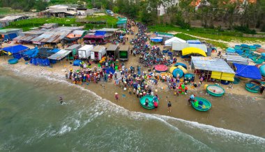 Mui Ne, Vietnam - July 1st, 2022: Mui Ne fish market seen from above, the morning, a coastal fishing village to buy and sell seafood for the central provinces in Mui Ne, Vietnam