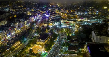 Aerial view of Da Lat city night beautiful tourism destination in central highlands Vietnam. Urban development texture, green parks and city lake.