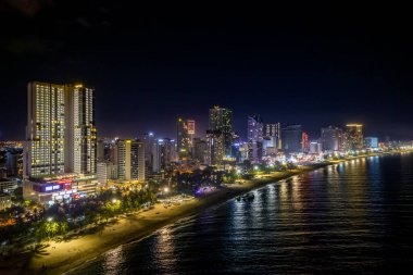 The coastal city of Nha Trang seen from above at night. This is a famous city for cultural tourism in central Vietnam