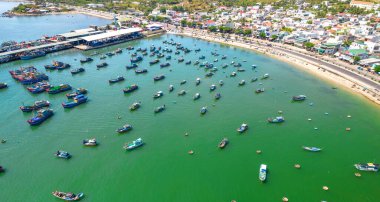Vinh Luong fishing village, Nha Trang, Vietnam seen from above with hundreds of boats anchored to avoid storms, traffic and densely populated areas below
