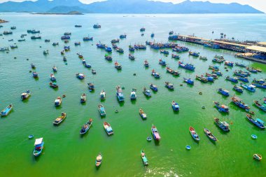 Vinh Luong fishing village, Nha Trang, Vietnam seen from above with hundreds of boats anchored to avoid storms, traffic and densely populated areas below