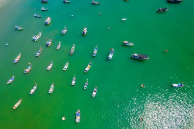Fishing wharf moored to avoid storms at noon in summer in the beautiful central waters of Vietnam
