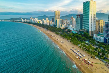 Nha Trang, Vietnam - July 4th, 2022: The coastal city of Nha Trang seen from above in the afternoon with its beautiful city and clean sandy beach attracts tourists to visit in Nha Trang, Vietnam