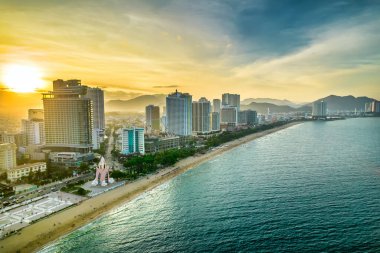 Nha Trang, Vietnam - July 4th, 2022: The coastal city of Nha Trang seen from above in the afternoon with its beautiful city and clean sandy beach attracts tourists to visit in Nha Trang, Vietnam
