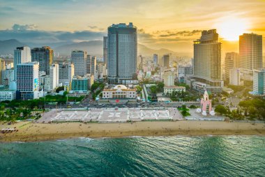 Nha Trang, Vietnam - July 4th, 2022: The coastal city of Nha Trang seen from above in the afternoon with its beautiful city and clean sandy beach attracts tourists to visit in Nha Trang, Vietnam