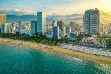 Nha Trang, Vietnam - July 4th, 2022: The coastal city of Nha Trang seen from above in the afternoon with its beautiful city and clean sandy beach attracts tourists to visit in Nha Trang, Vietnam