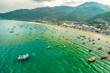 Dai Lanh fishing village seen from above with hundreds of boats anchored to avoid storms, this is a beautiful bay in Nha Trang, Vietnam