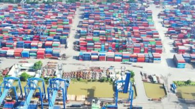 Ho Chi Minh city, Vietnam - June 4th, 2022: Aerial view of Cat Lai port with cargo ship and container. Large import-export port important for economic development in Ho Chi Minh City, Vietnam