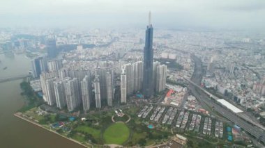 Ho Chi Minh city, Vietnam - June 4th, 2022: Aerial view morning of skyscrapers hidden in the clouds in the center of heart business at downtown in Ho Chi Minh City, Vietnam