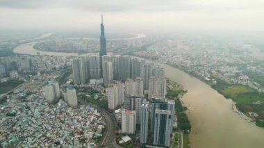 Ho Chi Minh city, Vietnam - June 4th, 2022: Aerial view morning of skyscrapers hidden in the clouds in the center of heart business at downtown in Ho Chi Minh City, Vietnam
