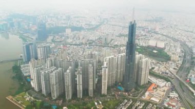 Ho Chi Minh city, Vietnam - June 4th, 2022: Aerial view morning of skyscrapers hidden in the clouds in the center of heart business at downtown in Ho Chi Minh City, Vietnam