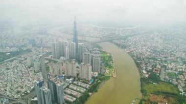 Ho Chi Minh city, Vietnam - June 4th, 2022: Aerial view morning of skyscrapers hidden in the clouds in the center of heart business at downtown in Ho Chi Minh City, Vietnam